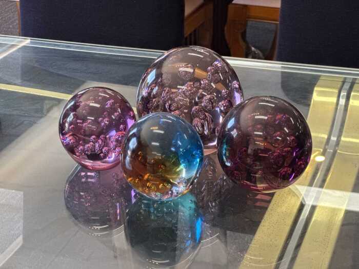 Four large paperweights