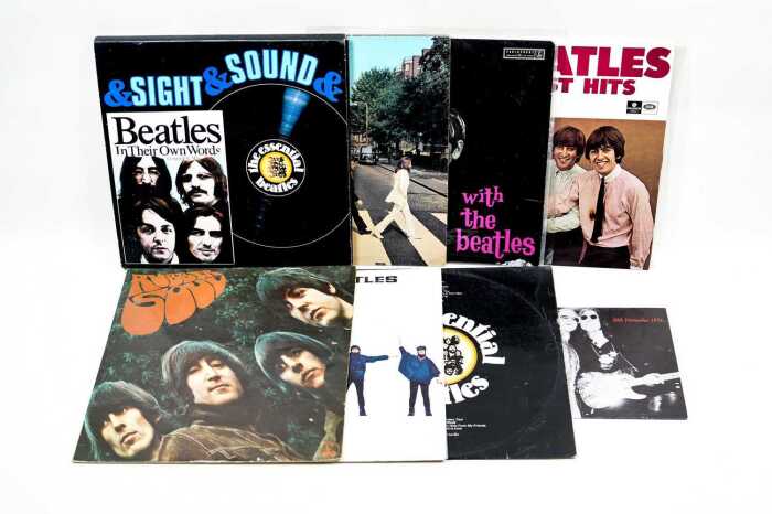 A collection of Beatles vinyl records, including '60s pressing