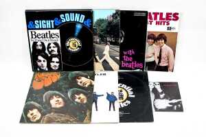 A collection of Beatles vinyl records, including '60s pressing