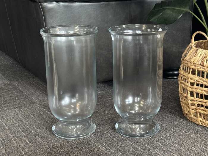 Pair of hurricane clear glass lamps