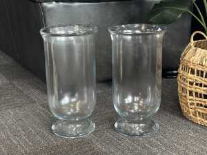 Pair of hurricane clear glass lamps