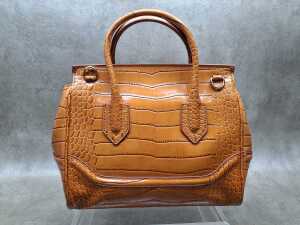 Designer-style handbag in brown with gold-tone hardware. - 3