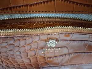 Designer-style handbag in brown with gold-tone hardware. - 6