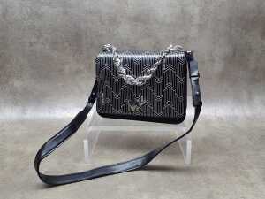 Designer-style black and silver-tone handbag.