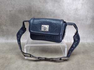 Designer-style handbag in navy and silver tones.