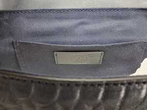 Designer-style handbag in navy and silver tones. - 2