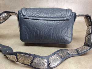 Designer-style handbag in navy and silver tones. - 3