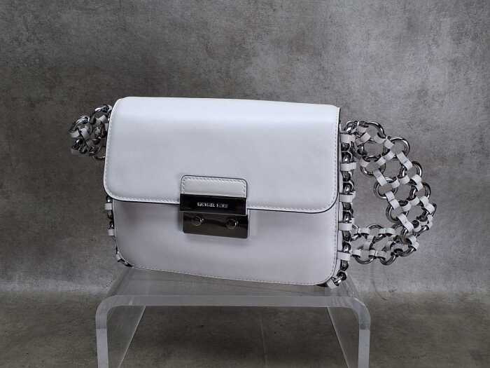 Designer-style handbag in white and silver tones.