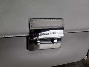 Designer-style handbag in white and silver tones. - 2