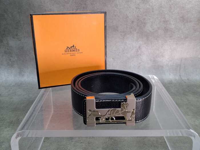 Designer-style black belt with horse and carriage buckle