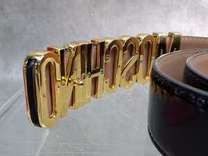 Designer-style black patent and gold-tone belt. - 4