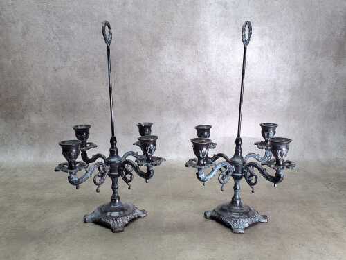 67 · Pair of cast bronze four branch candelabra
