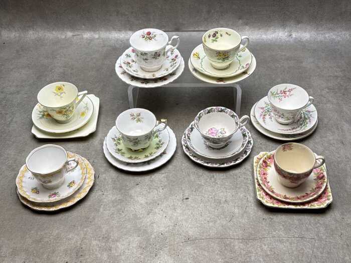 Eight English porcelain Royal Albert and Royal Doulton trios