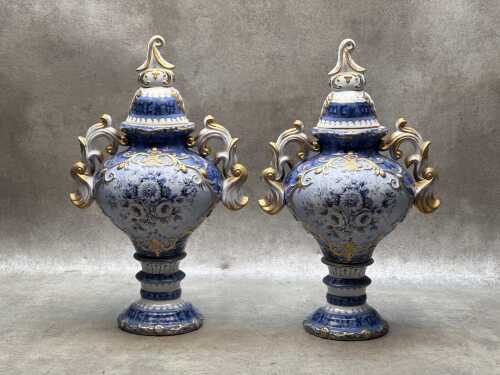 Pair of twin handled porcelain urns