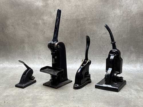 Four antique metal embossing stamp presses