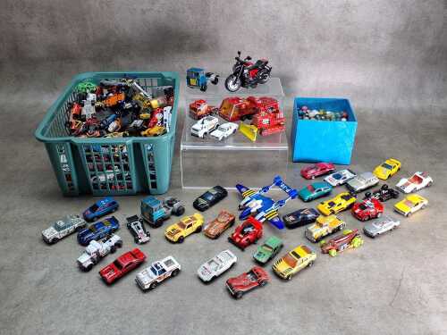 Collection of die-cast cars and marbles