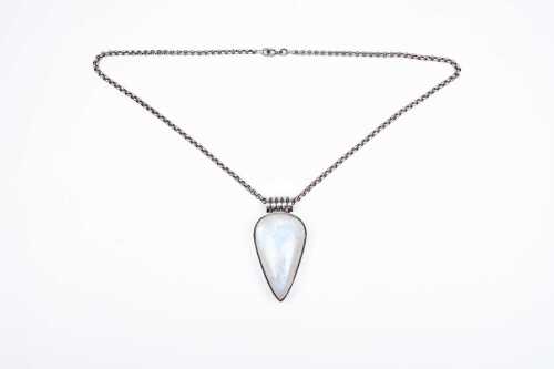 A rainbow quartz pendant and chain in sterling silver.