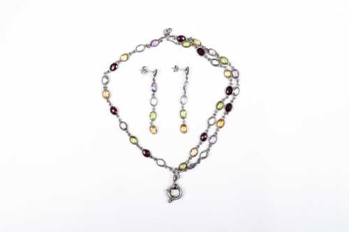 A gemstone bracelet and earring set in sterling silver
