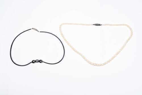 A strand of graduated pearls and a baroque Tahitian pearl collier