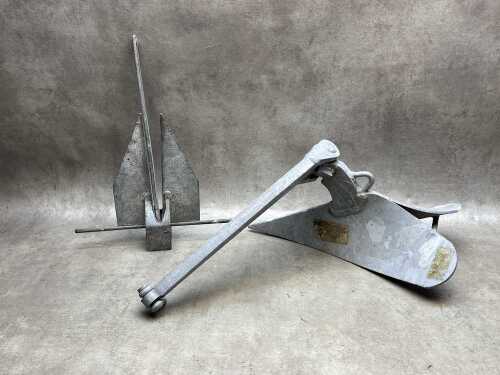 Two metal boat anchors