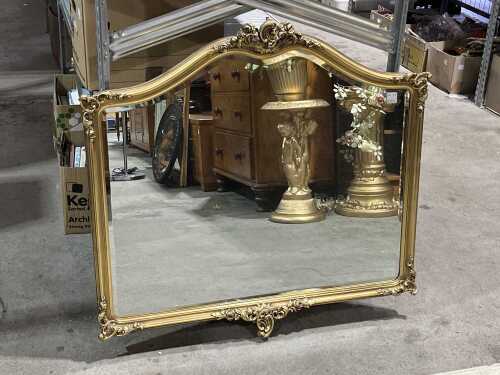 Ornate gilt wall mirror with bevelled edge