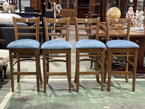 A set of four modern timber bar stools