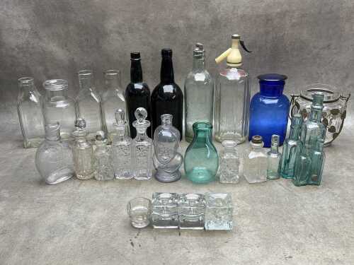 Vintage clear and coloured glass bottles