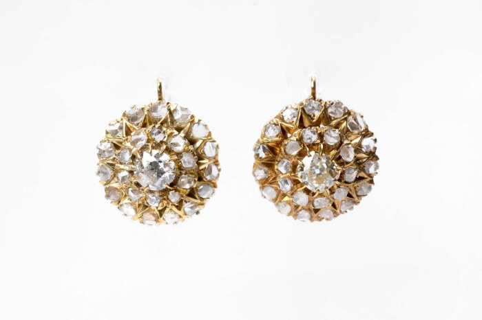 A pair of antique diamond earrings in 18 carat yellow gold