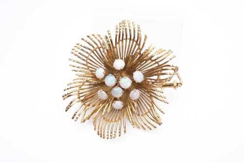 A vintage opal flower brooch in 14 carat yellow gold