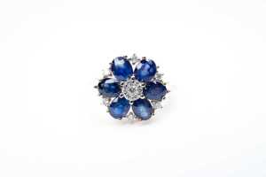 A sapphire and diamond ring in 14 carat yellow gold