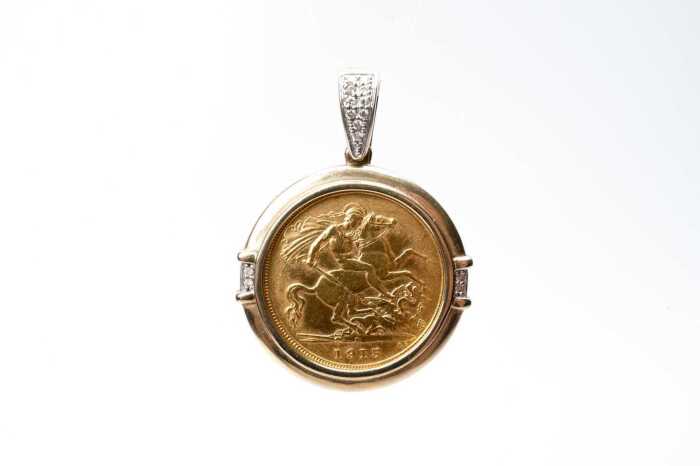A 22 carat 1915 half sovereign in a 9 carat diamond pendant