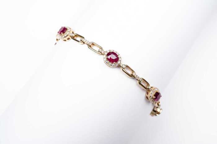 A ruby and diamond bracelet in 14 carat yellow gold