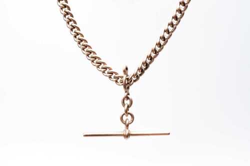 31 · An antique curb link fob necklace in 9 carat rose gold