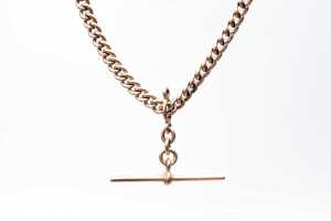 An antique curb link fob necklace in 9 carat rose gold