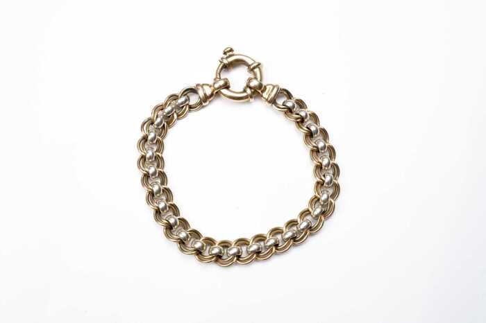 A fancy link bracelet in 9 carat two tone gold
