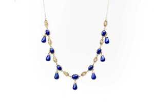 A lapis lazuli and diamond necklace in 14 carat yellow gold