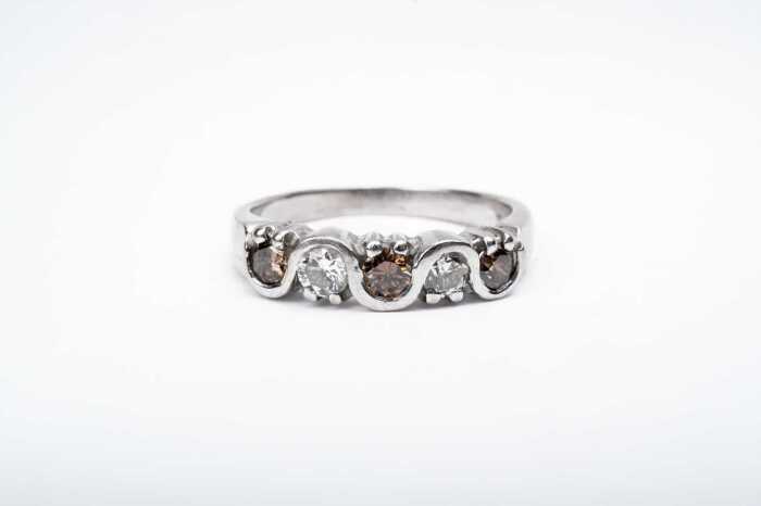 A champagne and white diamond ring in 18 carat white gold