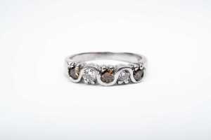A champagne and white diamond ring in 18 carat white gold