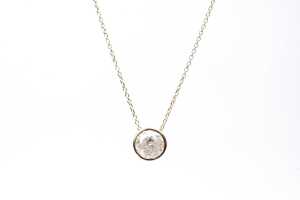 A diamond slider pendant on necklace in 14 carat yellow gold