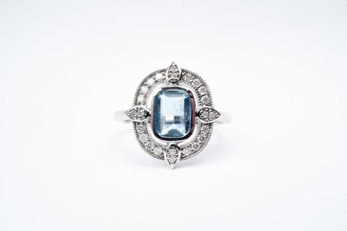 An aquamarine and diamond ring in 14 carat white gold
