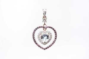 An aquamarine, pink sapphire and diamond pendant in 14 carat rose gold