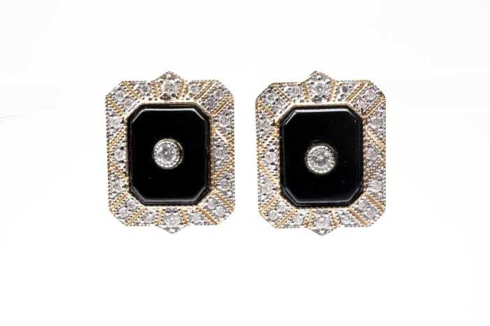 A pair of onyx and diamond earrings in 14 carat yellow gold