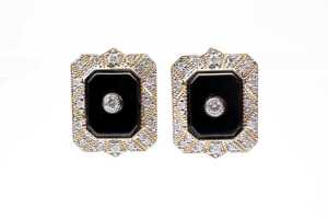A pair of onyx and diamond earrings in 14 carat yellow gold