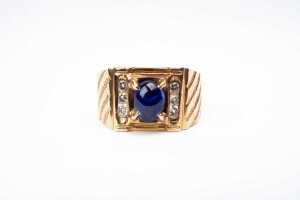 A sapphire and diamond ring in 18 carat yellow gold