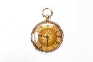 An antique pocket watch in 18 carat gold