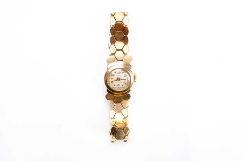 A vintage Light watch in 18 carat yellow gold