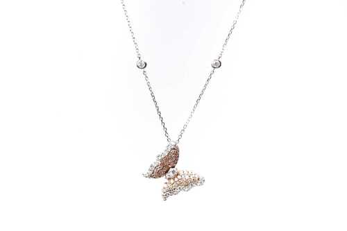 A pink and white diamond butterfly necklace in 14 carat white gold