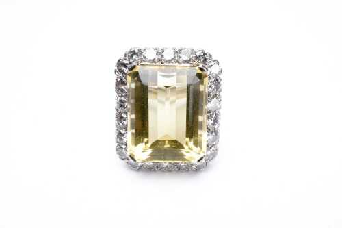 A heliodor and diamond ring in 18 carat white gold