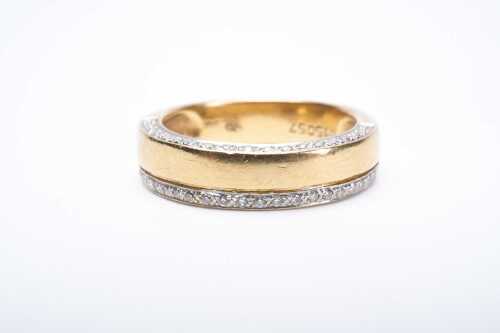 A diamond band in 18 carat yellow gold