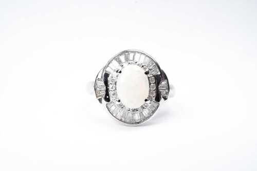 An opal and diamond ring in platinum